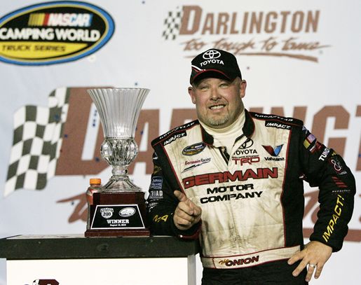 Todd Bodine, driver of the No. 30 Germain.com Toyota, celebrates in Victory Lane after winning the NASCAR Camping World Truck Series Too Tough To Tame 200 at Darlington Raceway Saturday in Darlington, S.C. Credit: Mary Ann Chastain/Getty Images for NASCAR